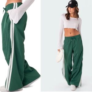 Green and white nylon track pants